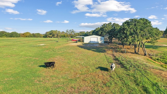 200 Leea Ln, Weatherford, TX 76087 - view of yard with an outdoor structure, a detached garage, a rural view, and fence