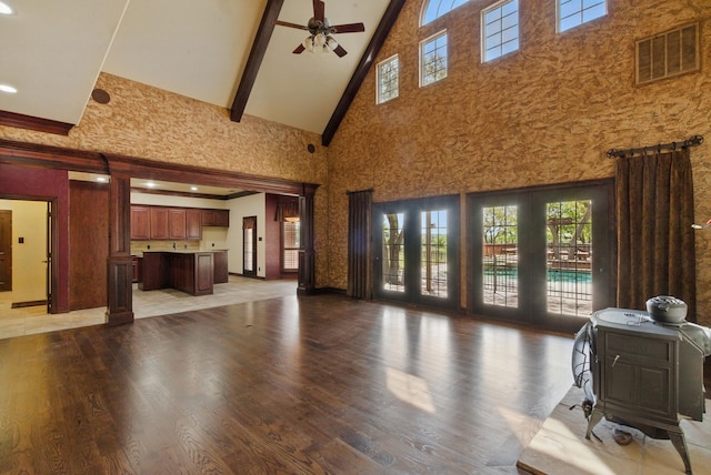 200 Leea Ln, Weatherford, TX 76087 - living area featuring plenty of natural light, high vaulted ceiling, light wood-style floors, and ceiling fan