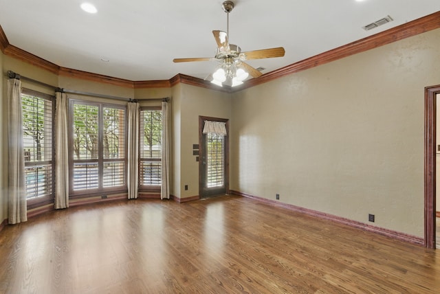 200 Leea Ln, Weatherford, TX 76087 - unfurnished room featuring baseboards, visible vents, a ceiling fan, wood finished floors, and ornamental molding