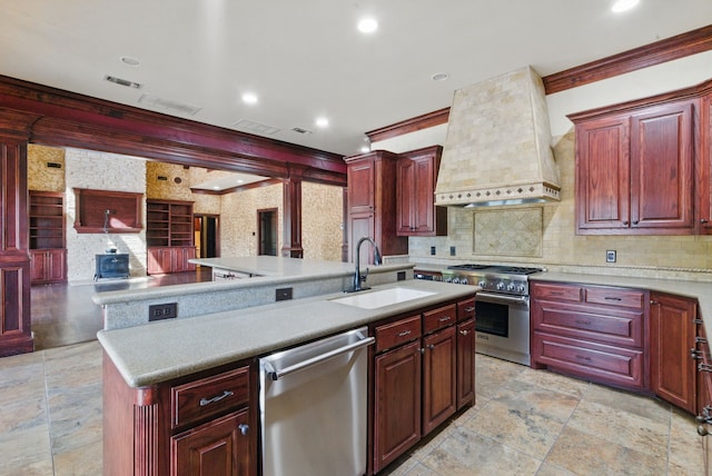 200 Leea Ln, Weatherford, TX 76087 - kitchen featuring visible vents, wall chimney range hood, reddish brown cabinets, a sink, and appliances with stainless steel finishes