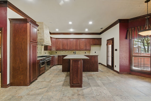 200 Leea Ln, Weatherford, TX 76087 - kitchen with high end stainless steel range, ornamental molding, a center island, decorative backsplash, and custom range hood