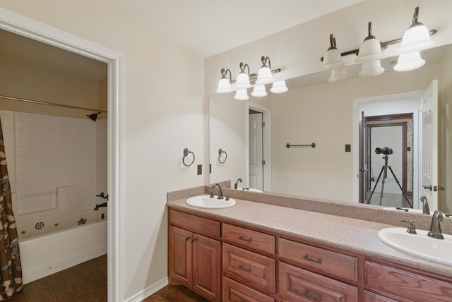 200 Leea Ln, Weatherford, TX 76087 - full bathroom with shower / bath combo, wood finished floors, a sink, and double vanity