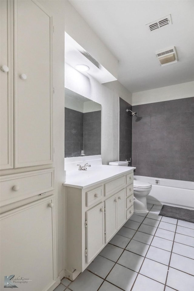 1026 Baylor St, Abilene, TX 79602 - bathroom featuring toilet, visible vents, tile patterned flooring, and vanity