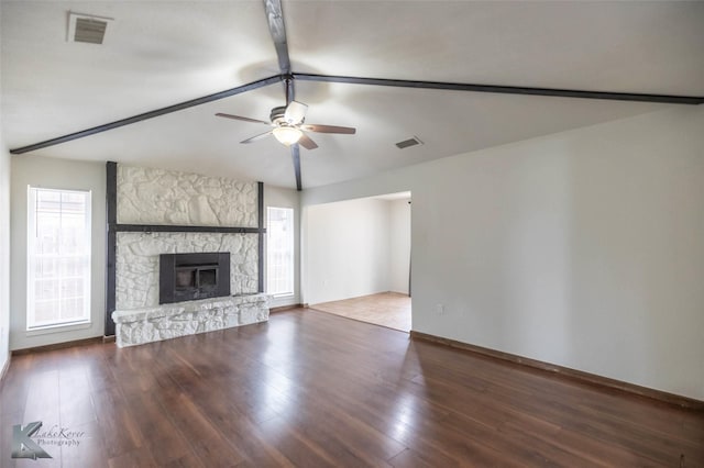 1026 Baylor St, Abilene, TX 79602 - unfurnished living room with a wealth of natural light, visible vents, a fireplace, and a ceiling fan