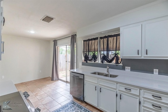1026 Baylor St, Abilene, TX 79602 - kitchen with a sink, visible vents, dishwasher, white cabinetry, and light countertops