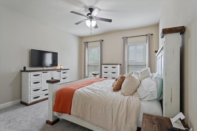 bedroom with baseboards, light carpet, and ceiling fan