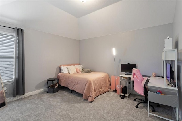 carpeted bedroom with vaulted ceiling