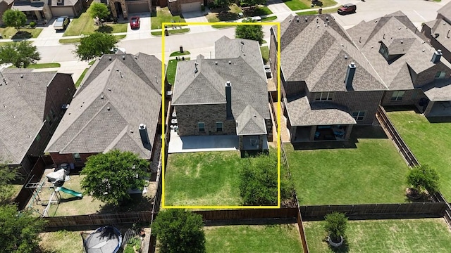 birds eye view of property with a residential view