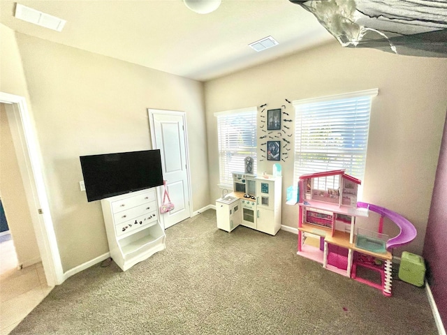 game room with carpet floors, visible vents, and baseboards