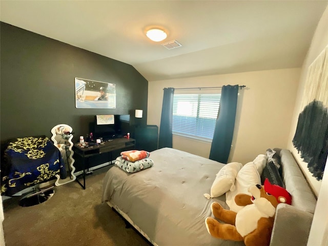 carpeted bedroom featuring lofted ceiling and visible vents