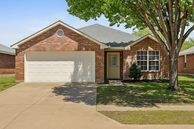 4823 Topaz Ln, Granbury, TX 76049 - single story home with brick siding, driveway, a front yard, and a garage