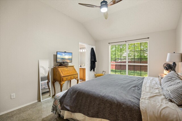 4823 Topaz Ln, Granbury, TX 76049 - bedroom with ceiling fan, carpet floors, baseboards, ensuite bath, and lofted ceiling