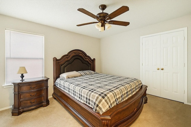4823 Topaz Ln, Granbury, TX 76049 - bedroom featuring baseboards, a closet, a ceiling fan, and light colored carpet