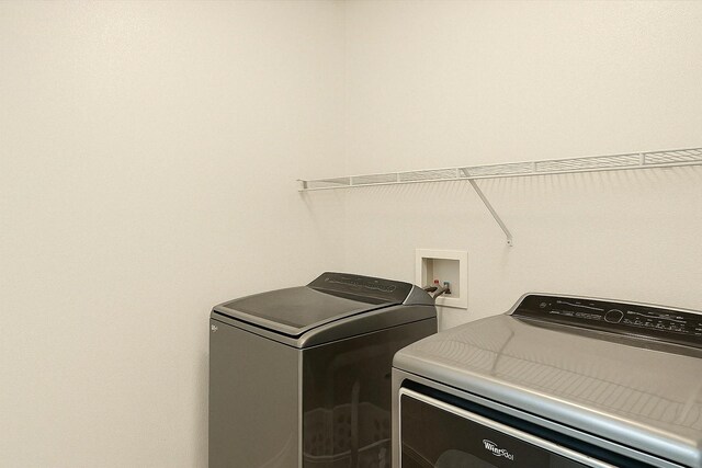 4823 Topaz Ln, Granbury, TX 76049 - clothes washing area with washing machine and clothes dryer and laundry area