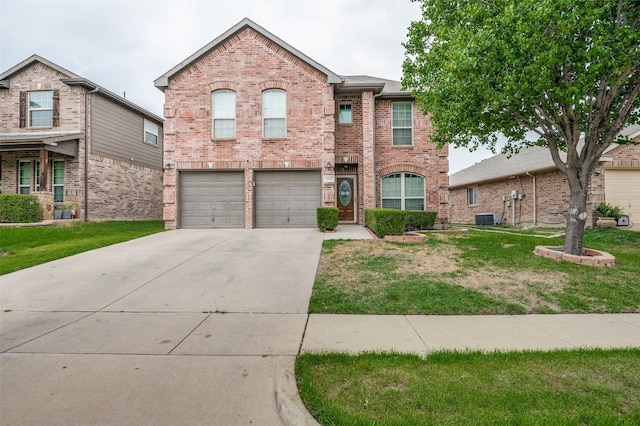 traditional-style house with central air condition unit, driveway, brick siding, a garage, and a front yard