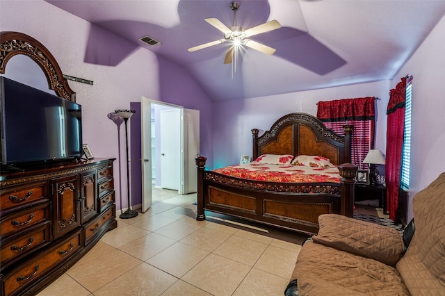bedroom with vaulted ceiling, visible vents, a ceiling fan, and light tile patterned floors