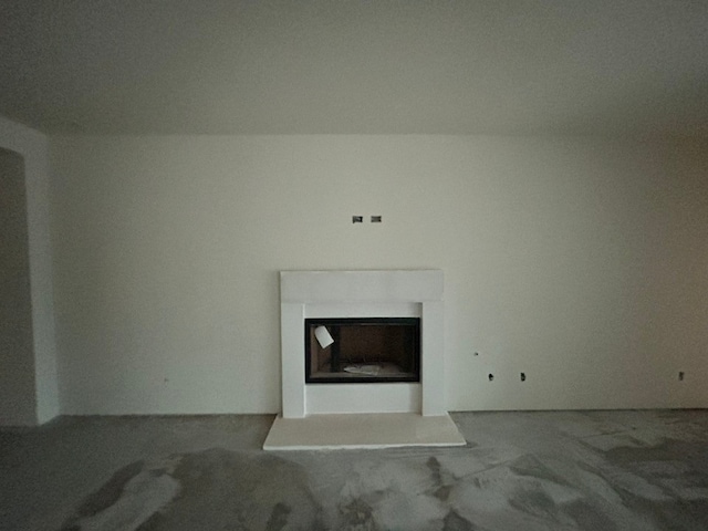 interior details with a fireplace with raised hearth