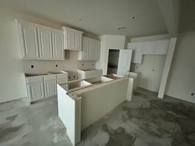 kitchen featuring a center island and white cabinetry