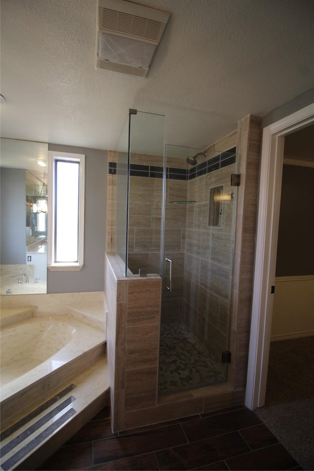 634 Ray Ave, Desoto, TX 75115 - full bathroom with tile patterned floors, vanity, a textured ceiling, and a stall shower