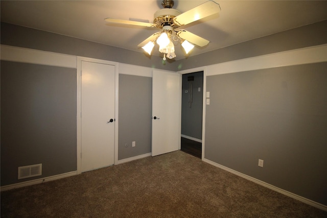 634 Ray Ave, Desoto, TX 75115 - unfurnished bedroom with dark carpet, ceiling fan, baseboards, and visible vents