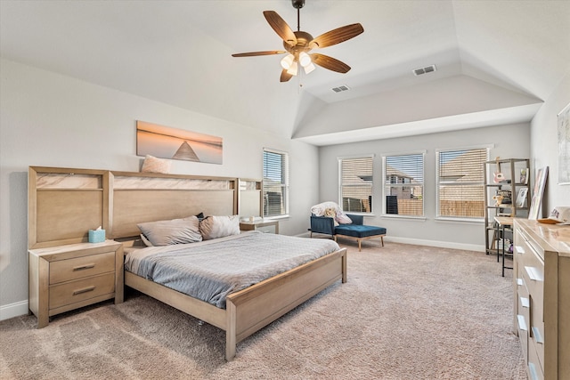 bedroom with light carpet, vaulted ceiling, visible vents, and baseboards
