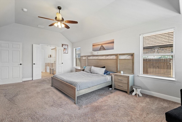 bedroom with light carpet, ensuite bathroom, baseboards, lofted ceiling, and a ceiling fan