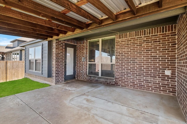 view of patio / terrace featuring fence