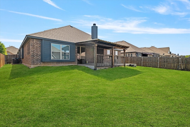 back of property featuring a fenced backyard, brick siding, a chimney, and a lawn
