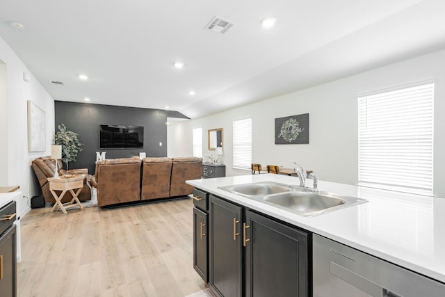 kitchen with a sink, visible vents, recessed lighting, light wood-style floors, and light countertops