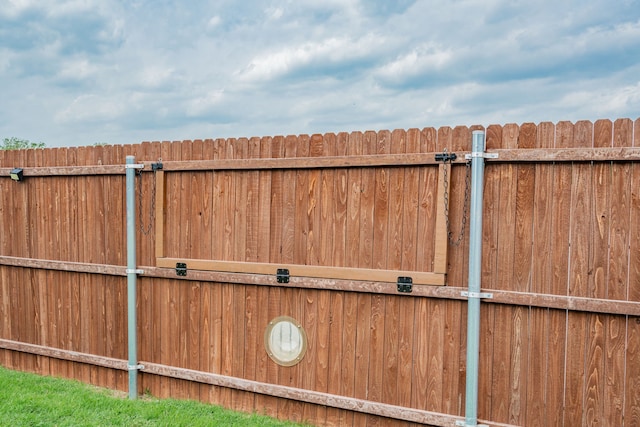 view of gate with fence