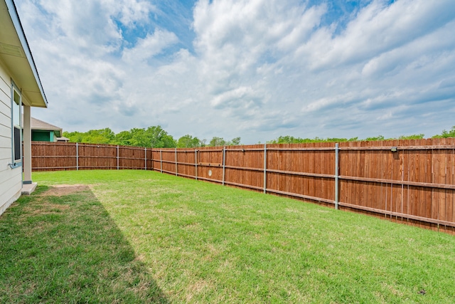 view of yard featuring a fenced backyard