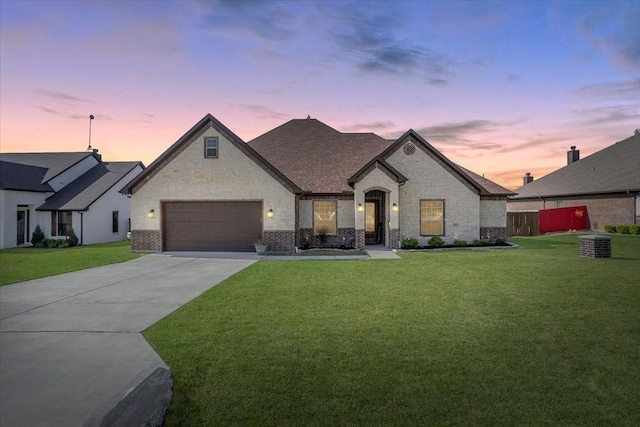 12409 Messer Ct, Fort Worth, TX 76126 - french country inspired facade featuring concrete driveway, brick siding, central AC, and a garage