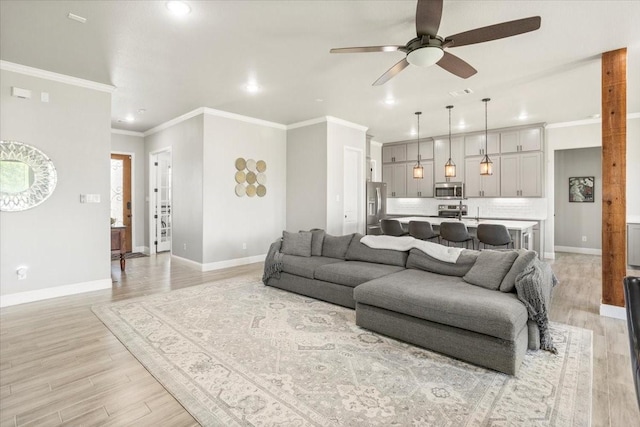 12409 Messer Ct, Fort Worth, TX 76126 - living room with ceiling fan, light wood-style floors, baseboards, recessed lighting, and crown molding