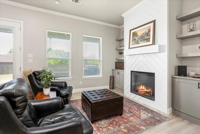 12409 Messer Ct, Fort Worth, TX 76126 - living room featuring a fireplace, light wood-style flooring, ornamental molding, and baseboards