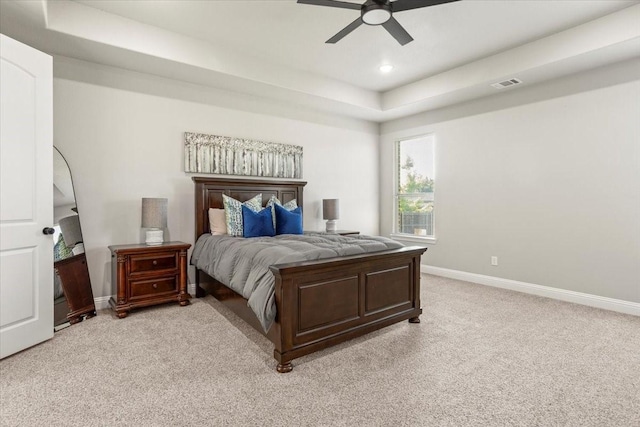 12409 Messer Ct, Fort Worth, TX 76126 - bedroom with light carpet, baseboards, a tray ceiling, ceiling fan, and recessed lighting