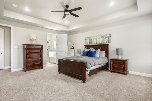 12409 Messer Ct, Fort Worth, TX 76126 - bedroom with a raised ceiling, light colored carpet, baseboards, recessed lighting, and connected bathroom
