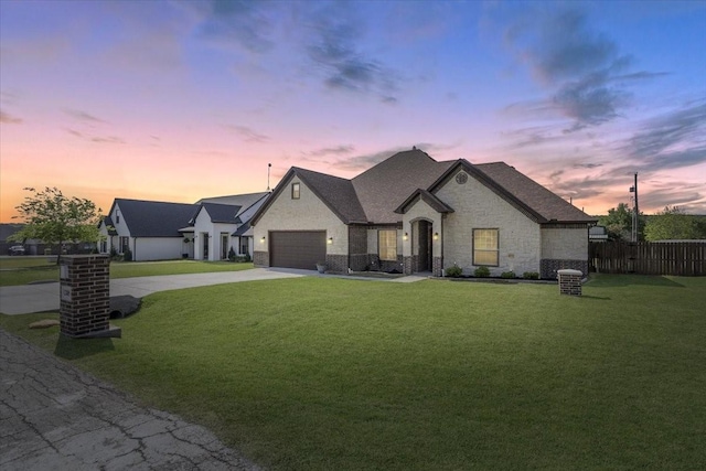 12409 Messer Ct, Fort Worth, TX 76126 - french country home featuring concrete driveway and an attached garage