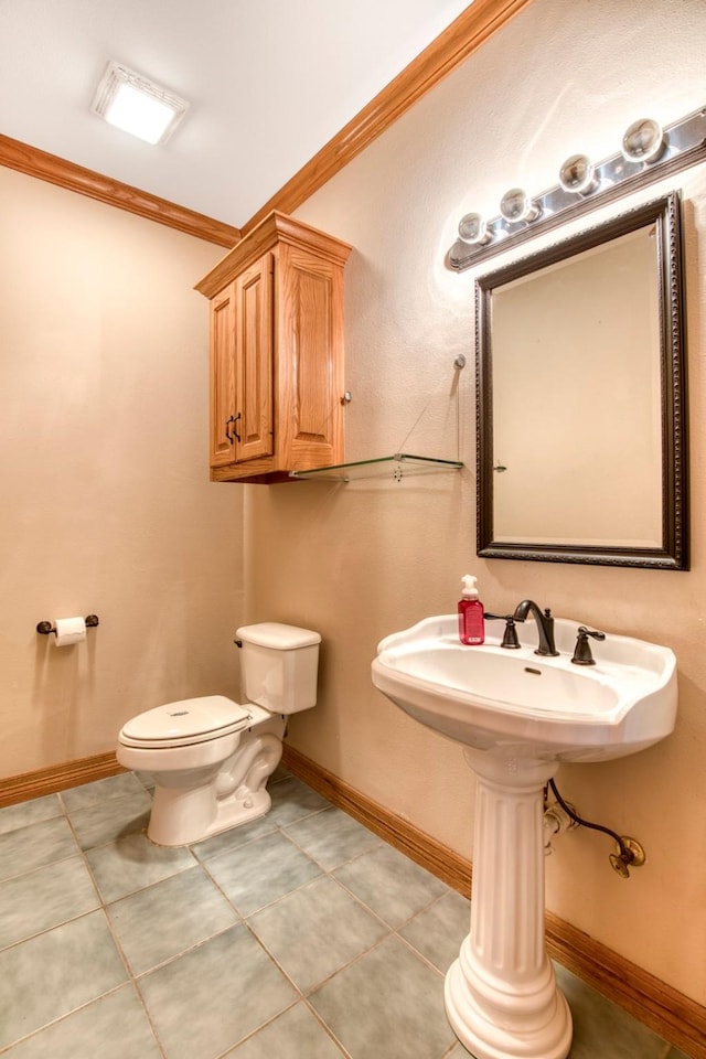 2176 English Rd, Rockwall, TX 75032 - half bath with toilet, ornamental molding, tile patterned flooring, and baseboards