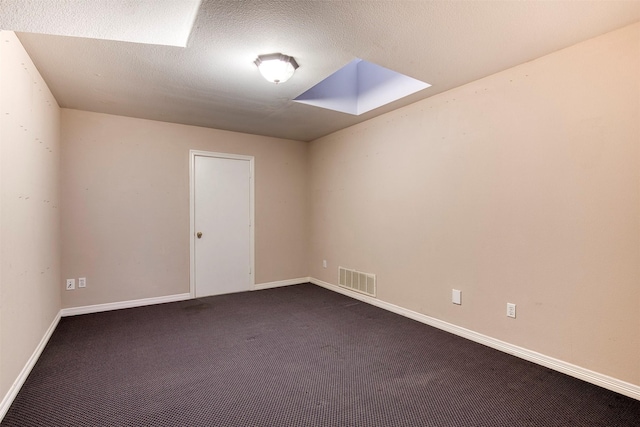 2176 English Rd, Rockwall, TX 75032 - spare room with dark colored carpet, visible vents, and baseboards