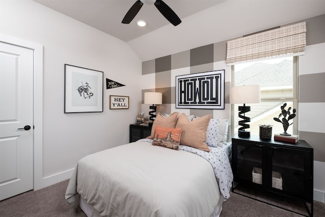 bedroom with ceiling fan, vaulted ceiling, carpet floors, and baseboards