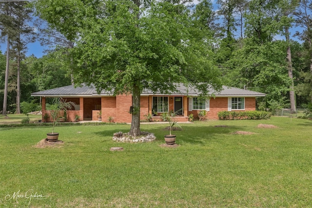 1042 N Lane Dr, Shreveport, LA 71107 - view of front of property with a porch, a front lawn, fence, and metal roof
