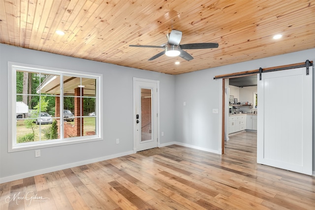 1042 N Lane Dr, Shreveport, LA 71107 - unfurnished room with a ceiling fan, recessed lighting, light wood-style flooring, and a barn door
