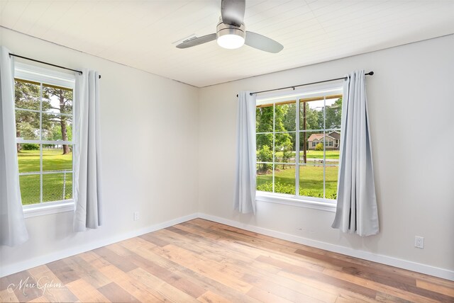 1042 N Lane Dr, Shreveport, LA 71107 - spare room with hardwood / wood-style flooring, a ceiling fan, baseboards, and a healthy amount of sunlight