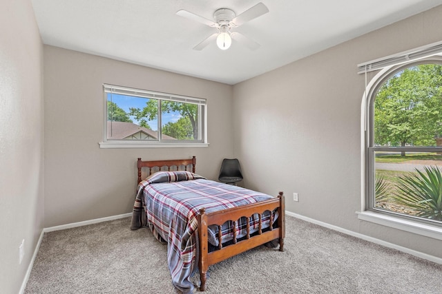 bedroom featuring carpet floors, baseboards, and ceiling fan