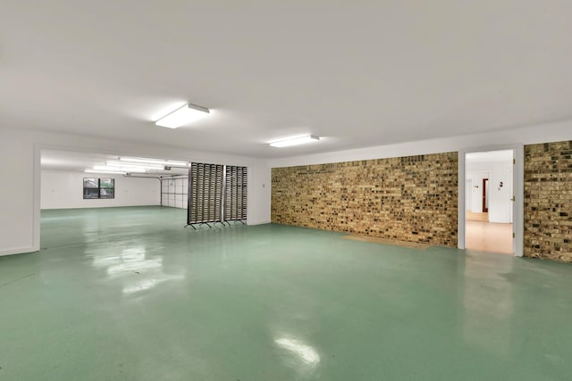 below grade area featuring brick wall