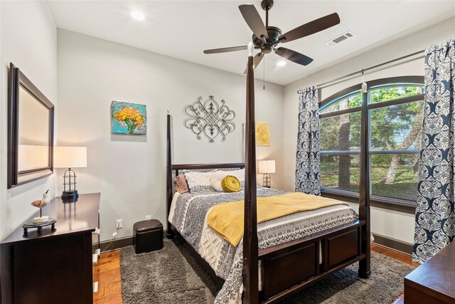 bedroom with ceiling fan, wood finished floors, visible vents, and recessed lighting