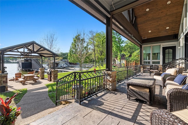 view of patio with a water view