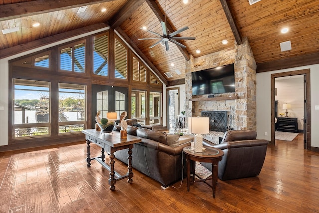 living room with hardwood / wood-style floors, beam ceiling, a wealth of natural light, wood ceiling, and a fireplace