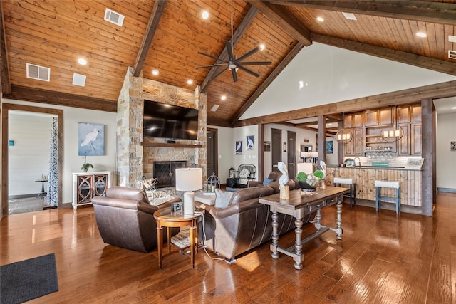 living area featuring wooden ceiling, visible vents, high vaulted ceiling, and ceiling fan
