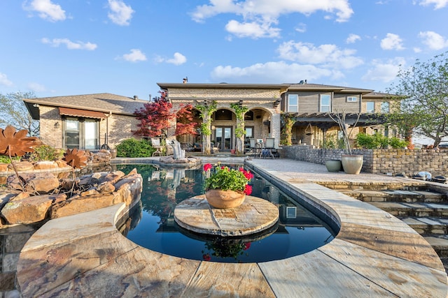 outdoor pool featuring a patio